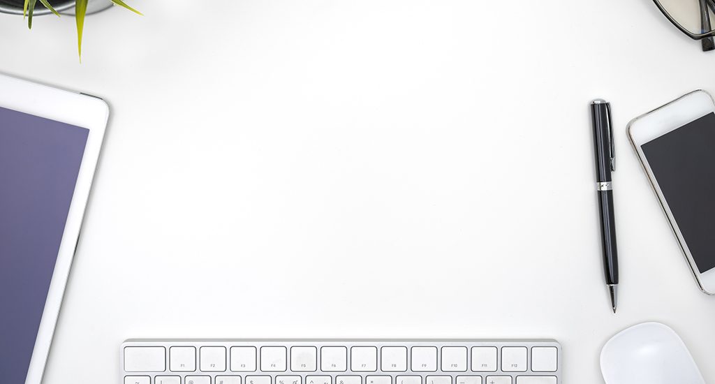 Frame with office equipment on white desk with copy space, flat lay style